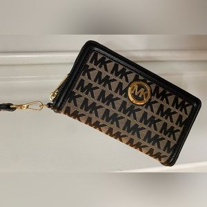 Michael Kors Continental Wallet with strap. Excellent condition, gently used